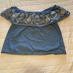 off the shoulder blue shirt with embroidered flowers